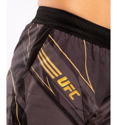 VENUM SHORT UFC REPLICA MUJER - NEGRO/DORADO